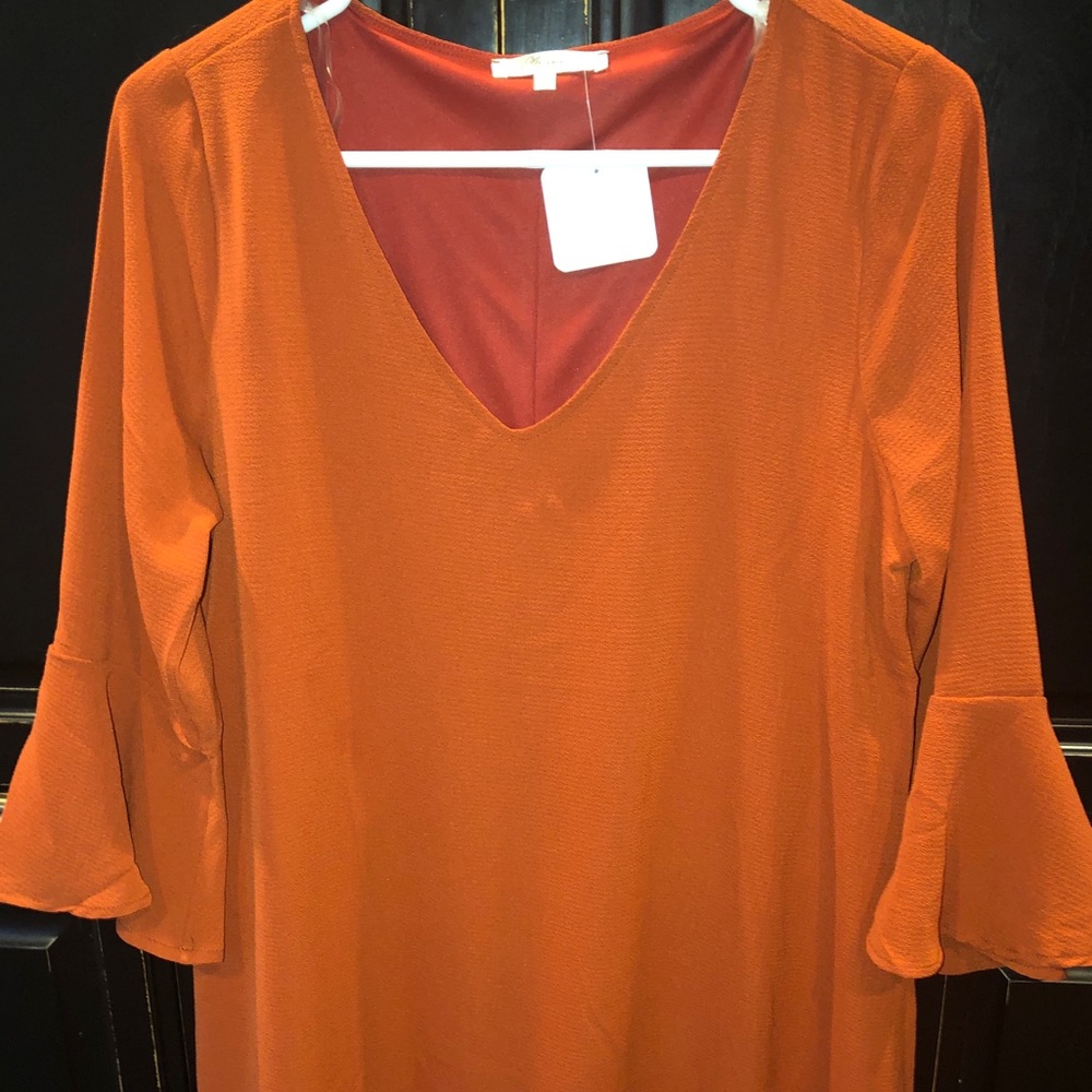 orange dress with bell sleeves